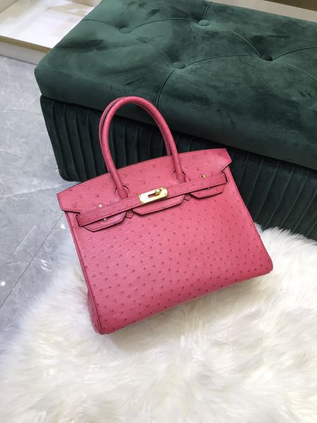 designers tote red ostrich handbag luxury purse imported leather fully handmade wax line stitiching more other brand products pls check out
designers tote red ostrich handbag luxury purse imported leather fully handmade wax line stitiching more other brand products pls check out