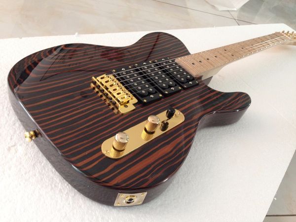 good quality customized electric guitar zebra one piece wood body gold hardware 3pcs humbuckers
good quality customized electric guitar zebra one piece wood body gold hardware 3pcs humbuckers
