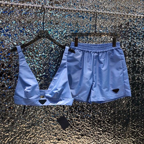 2022 the new casual women two piece pants recycled nylon fabric metal logo embellished bra mini tank with elastic waist shorts set,high qual, White
2022 the new casual women two piece pants recycled nylon fabric metal logo embellished bra mini tank with elastic waist shorts set,high qual, White