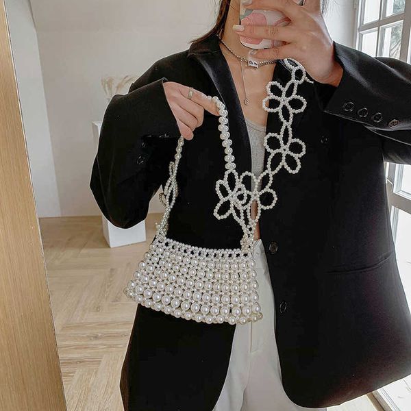 2021 french bow flower chain hand woven beaded pearl bag mobile phone msenger bag female
2021 french bow flower chain hand woven beaded pearl bag mobile phone msenger bag female