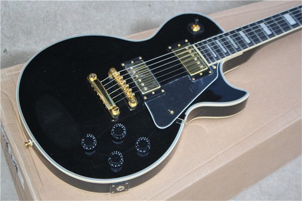 black electric guitar, ebony fingerboard, gold hardware, solid mahogany body electric guitar
black electric guitar, ebony fingerboard, gold hardware, solid mahogany body electric guitar
