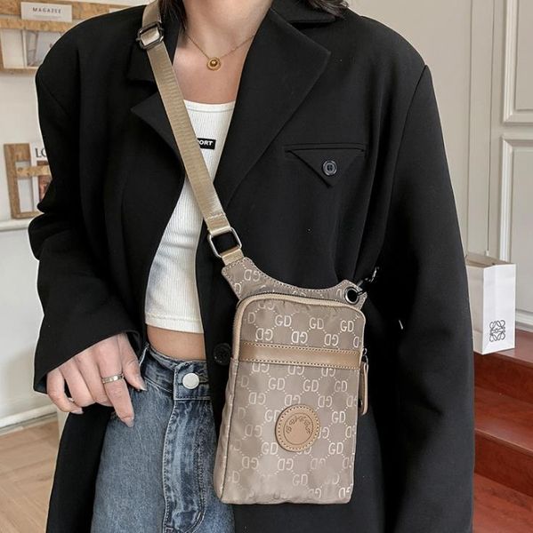 shoulder bags 2022 brand design personality mobile phone female crossbody hanging neck cloth small change summer mini bag
shoulder bags 2022 brand design personality mobile phone female crossbody hanging neck cloth small change summer mini bag