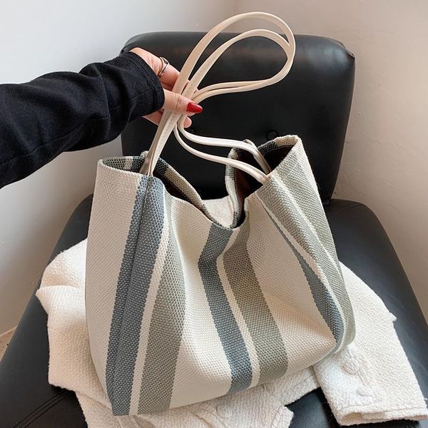 evening bags luxury design high capacity buckle tote handbag for women 2021 summer retro designer striped shopper shoulder shopping bag 
evening bags luxury design high capacity buckle tote handbag for women 2021 summer retro designer striped shopper shoulder shopping bag