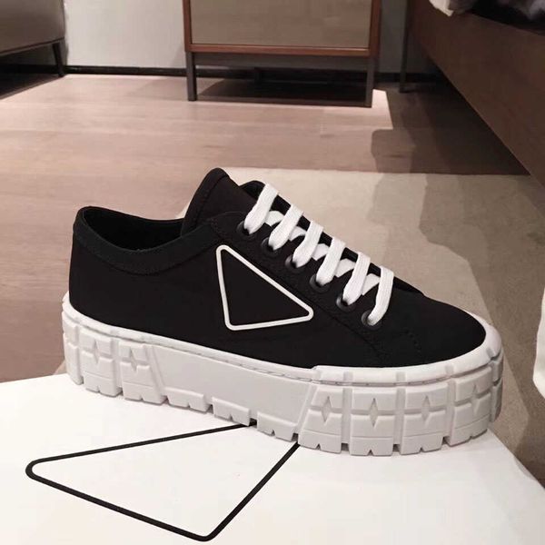 designer boots rubber platform inspired by motocross tires defines the unusual design of these nylon gabardine sneakers. the triangle, Black
designer boots rubber platform inspired by motocross tires defines the unusual design of these nylon gabardine sneakers. the triangle, Black