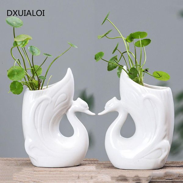creative ceramic personality animal cartoon white hydroponic vase living room deskflower pot home decoration ornaments1 vases
creative ceramic personality animal cartoon white hydroponic vase living room deskflower pot home decoration ornaments1 vases
