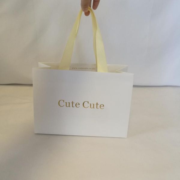 gift wrap 500pcs thick white paper bag with customized gold logo and ribbon handle for shopping packing party
gift wrap 500pcs thick white paper bag with customized gold logo and ribbon handle for shopping packing party