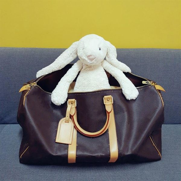 designers duffel bags 45cm 55cm luxury large capacity travel sale women men genuine leather shoulder fashion bag carry rivets with lock head
designers duffel bags 45cm 55cm luxury large capacity travel sale women men genuine leather shoulder fashion bag carry rivets with lock head