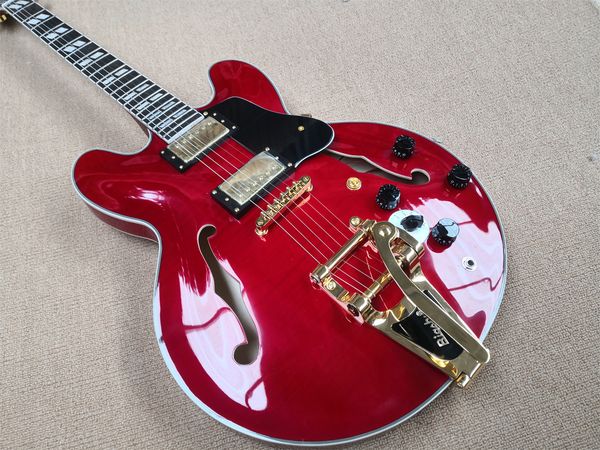 classic 335 electric guitar, semi-hollow red body, flamed veneer, golden tremolo bridge, rose wood fingerboard
classic 335 electric guitar, semi-hollow red body, flamed veneer, golden tremolo bridge, rose wood fingerboard