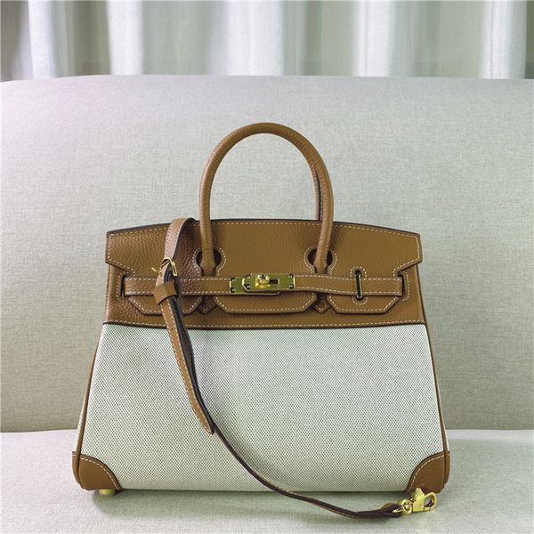 design 2021 new head leather splicing canvas color contrast bag large capacity one shoulder messenger women's handbag, Red;black
design 2021 new head leather splicing canvas color contrast bag large capacity one shoulder messenger women's handbag, Red;black