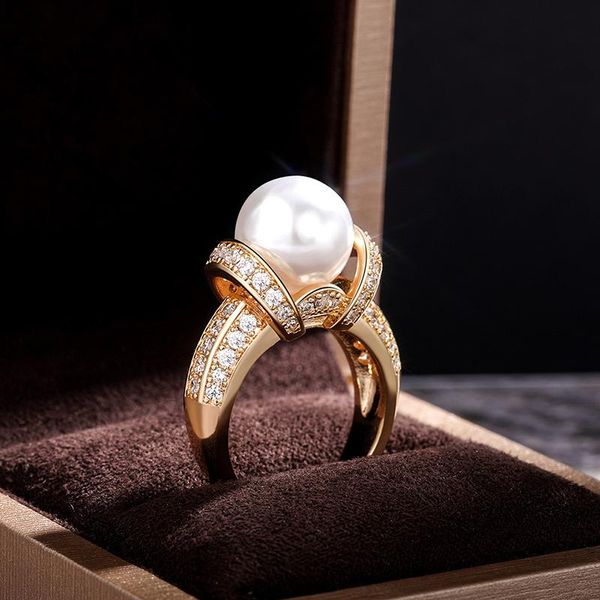 wedding rings exquisite gold color simulated pearl for women white shine cz stone micro paved engagement trendy jewelry band, Slivery;golden
wedding rings exquisite gold color simulated pearl for women white shine cz stone micro paved engagement trendy jewelry band, Slivery;golden