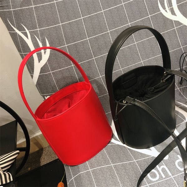 handbag women's bag fashion summer simple pu leather personality portable bucket one shoulder slant span, Black;red
handbag women's bag fashion summer simple pu leather personality portable bucket one shoulder slant span, Black;red