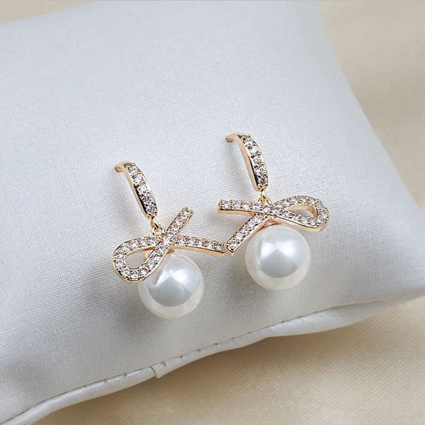 ear korean short hook symmetrical bow pearl earrings personality simple temperament small net red female, Golden
ear korean short hook symmetrical bow pearl earrings personality simple temperament small net red female, Golden
