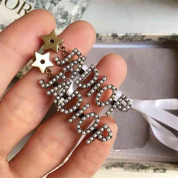 70% off outlet online family silver needle pearl micro inlaid earrings with letters hanging on the front and back, Golden
70% off outlet online family silver needle pearl micro inlaid earrings with letters hanging on the front and back, Golden