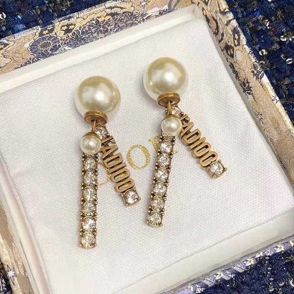 925 silver needle two large pearl letter tassel earrings simple fashion personality net red earrings for women
925 silver needle two large pearl letter tassel earrings simple fashion personality net red earrings for women