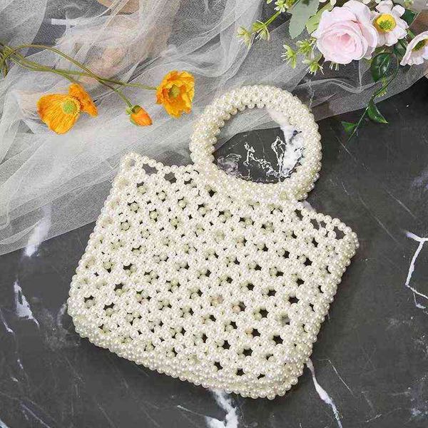 shopping bags handmade pearl hollow beaded handbag fashion ladies luxury handbags women designer summer party beach tote220307
shopping bags handmade pearl hollow beaded handbag fashion ladies luxury handbags women designer summer party beach tote220307
