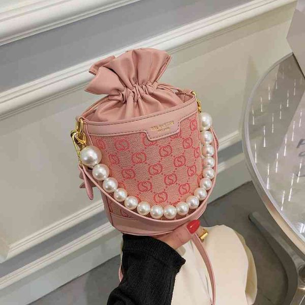 small bag female new fashion high sense style messenger versatile pearl portable bucket purse sale