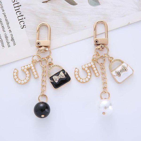 keychains pearl handbag keychain creative metal pendant cute girl 5 word lady bag key chains charms couple gift women decoration, Silver
keychains pearl handbag keychain creative metal pendant cute girl 5 word lady bag key chains charms couple gift women decoration, Silver