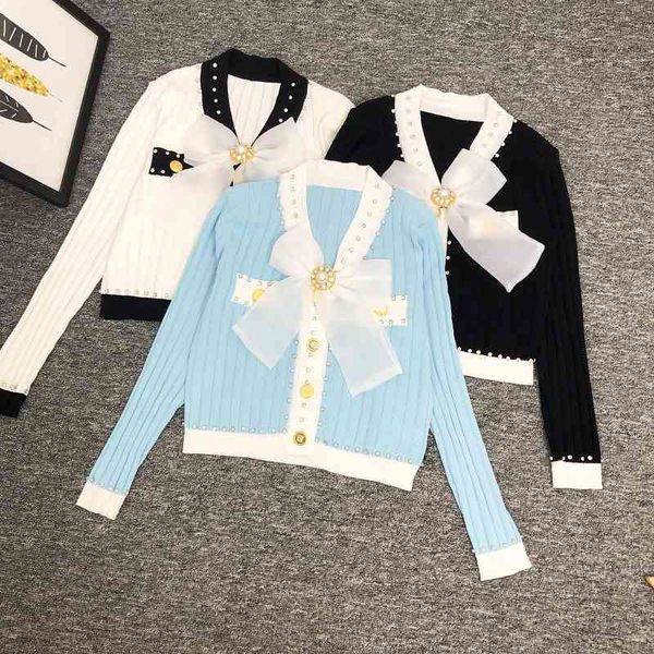 sweater knit autumn and winter 2021 women's v-neck long sleeve contrast color large bow beading slim fit short ted cardigan, White;black
sweater knit autumn and winter 2021 women's v-neck long sleeve contrast color large bow beading slim fit short ted cardigan, White;black