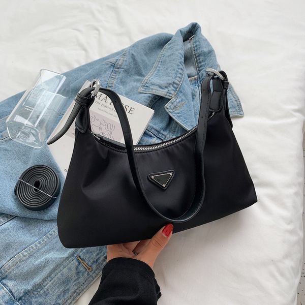luxury quality triangle 2021 autumn small satchel fashion messenger single shoulder armpit bag
luxury quality triangle 2021 autumn small satchel fashion messenger single shoulder armpit bag