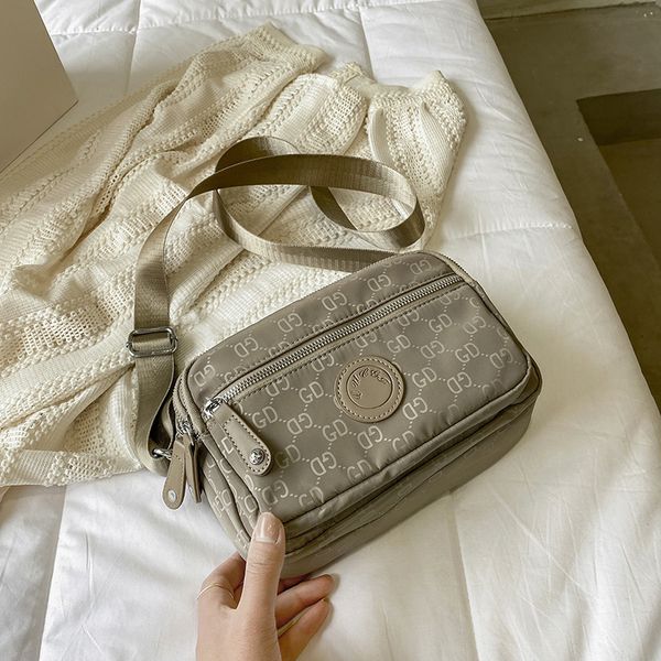 fashion mother's nylon oxford women's messenger bag single shoulder canvas light multi-layer leisure bag handbags
fashion mother's nylon oxford women's messenger bag single shoulder canvas light multi-layer leisure bag handbags