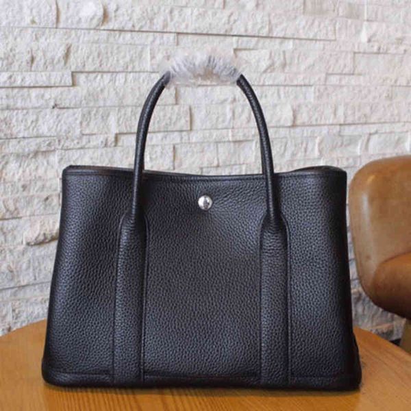 design handbag women's 2021 simple ladies fashion luxury garden bag litchi grain head leather handbag
design handbag women's 2021 simple ladies fashion luxury garden bag litchi grain head leather handbag