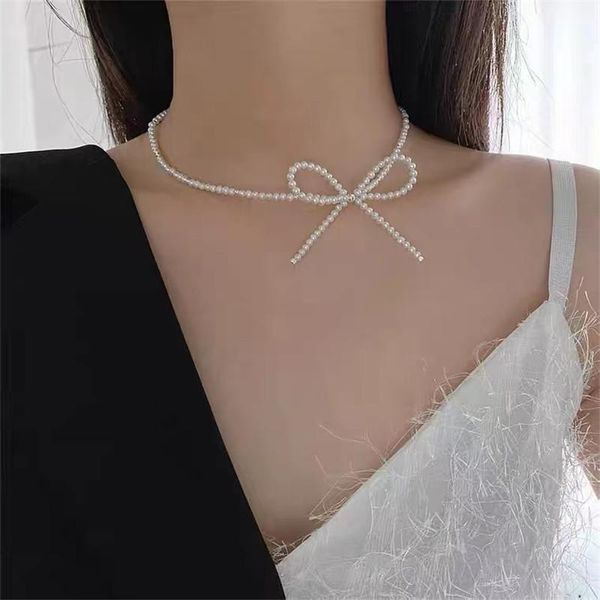 chokers elegant big white imitation pearl beads choker bow-knot clavicle chain necklace for women wedding jewelry collar 2021, Golden;silver
chokers elegant big white imitation pearl beads choker bow-knot clavicle chain necklace for women wedding jewelry collar 2021, Golden;silver