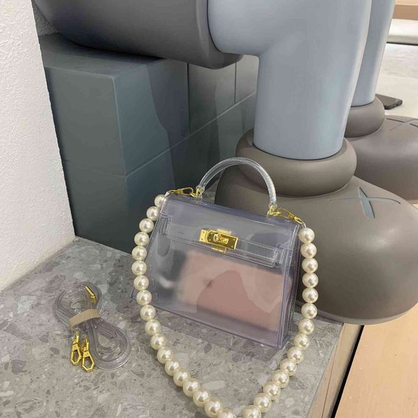 ins pearl beaded transparent kelly portable one shoulder messenger women's bag fashion trend versatile niche 
ins pearl beaded transparent kelly portable one shoulder messenger women's bag fashion trend versatile niche