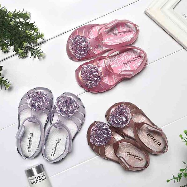 brazil new little girl's shell glittering powder jelly baotou cute baby cool slippers beach shoes
brazil new little girl's shell glittering powder jelly baotou cute baby cool slippers beach shoes