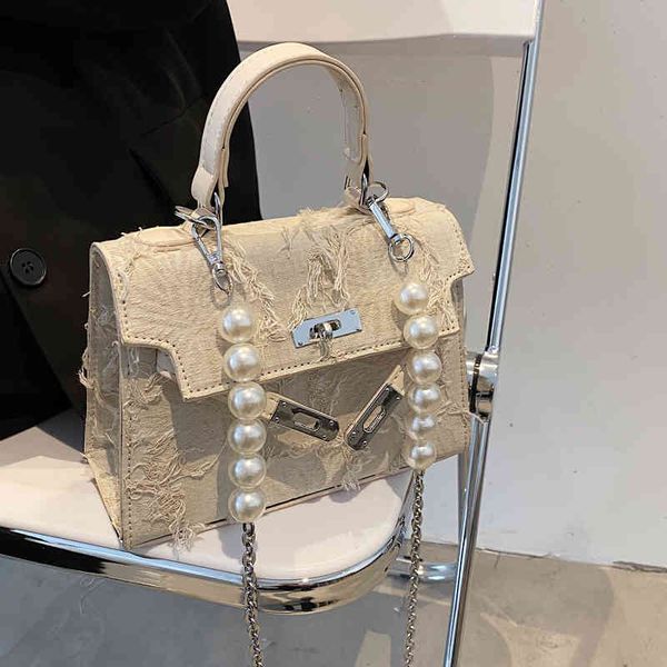 hand made denim stitching beggars canvas niche one shoulder straddle kelly tassel handbag
hand made denim stitching beggars canvas niche one shoulder straddle kelly tassel handbag