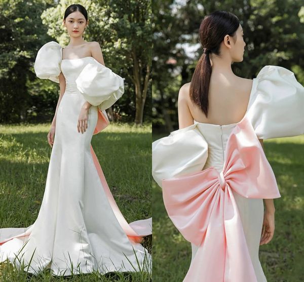 2022 exaggerated puff short sleeves elegant wedding gowns with pink big bowknot mermaid satin simple bride dresses long train robes de marié, White
2022 exaggerated puff short sleeves elegant wedding gowns with pink big bowknot mermaid satin simple bride dresses long train robes de marié, White