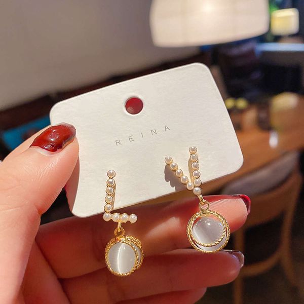 925 silver needle korean asymmetric geometric pearl net red personality cat's eye stone simple fashion earrings women, Black
925 silver needle korean asymmetric geometric pearl net red personality cat's eye stone simple fashion earrings women, Black