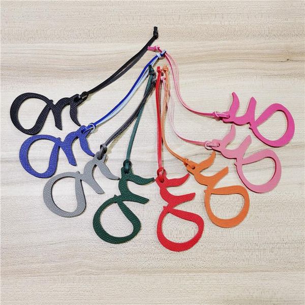 keychains 2021 custom made luxury genuine natural leather character alphabet arabic keychain backpack pendant ladies women bag wholesale, Silver
keychains 2021 custom made luxury genuine natural leather character alphabet arabic keychain backpack pendant ladies women bag wholesale, Silver