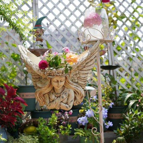 european wall hanging retro flower pot half face angel statue cylinder character girl garden courtyard decoration ornaments decorations
european wall hanging retro flower pot half face angel statue cylinder character girl garden courtyard decoration ornaments decorations