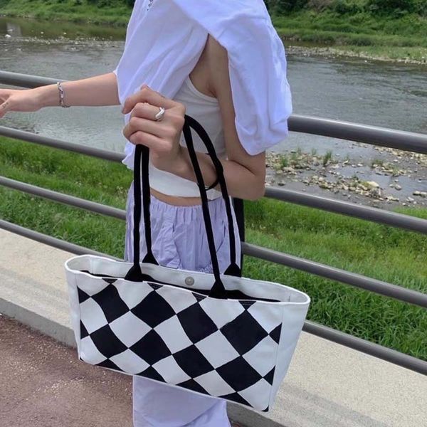 korean niche new trendy checkerboard portable one shoulder high capacity canvas bag tote women's leisure
korean niche new trendy checkerboard portable one shoulder high capacity canvas bag tote women's leisure