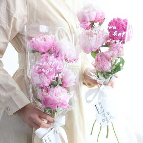net red flower bag transparent english waterproof rose bouquet packaging for valentine's day shop gift wrap
net red flower bag transparent english waterproof rose bouquet packaging for valentine's day shop gift wrap