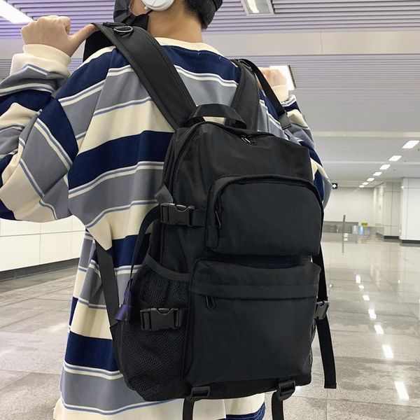 large capacity men backpack solid color waterproof nylon women double pocket schoolbag buckle travel bag
large capacity men backpack solid color waterproof nylon women double pocket schoolbag buckle travel bag