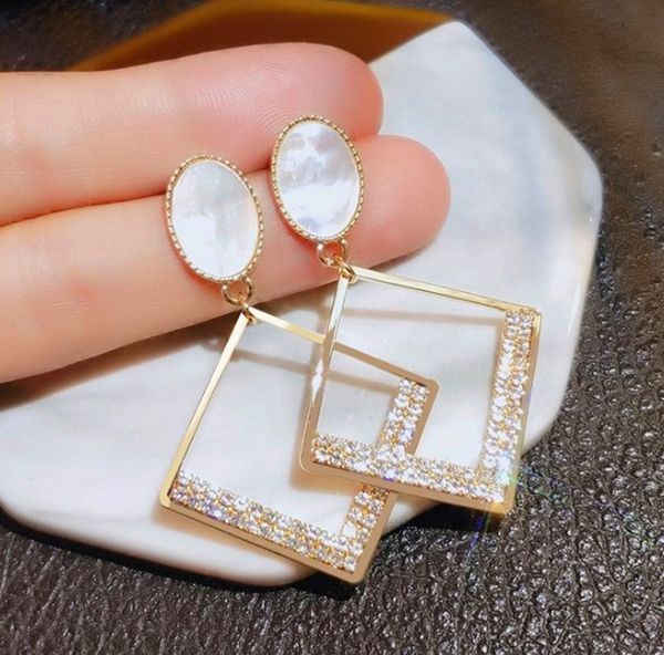 square hollowed out chandelier 925 silver needle temperament net red inlaid with flashing diamond drop glaze earrings
square hollowed out chandelier 925 silver needle temperament net red inlaid with flashing diamond drop glaze earrings