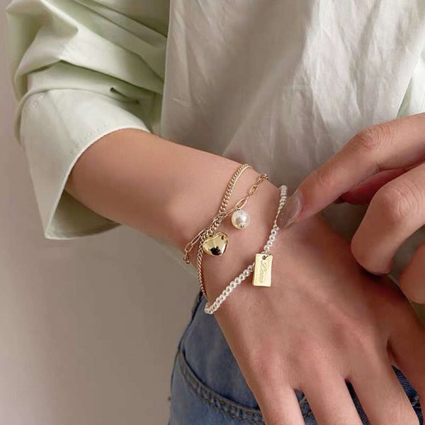 three layers of pearl love bracelet with adjustable temperament, Black
three layers of pearl love bracelet with adjustable temperament, Black