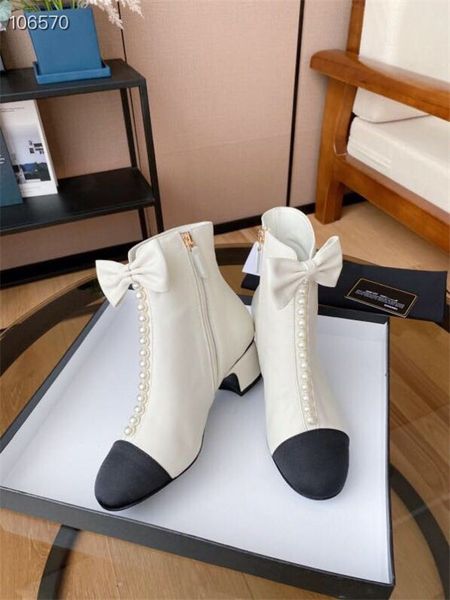 new arrived woman winter fashion martin boots femal pearl beading chunky heel bowtie shoes size 35-40 black white color
new arrived woman winter fashion martin boots femal pearl beading chunky heel bowtie shoes size 35-40 black white color