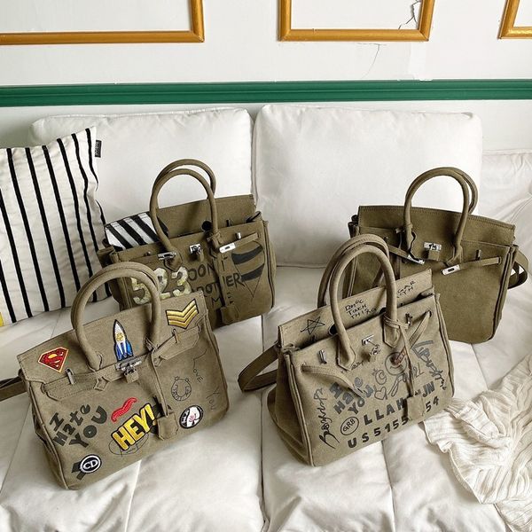 women's 2021 new casual versatile canvas hand large capacity graffiti one shoulder messenger frog bag
women's 2021 new casual versatile canvas hand large capacity graffiti one shoulder messenger frog bag