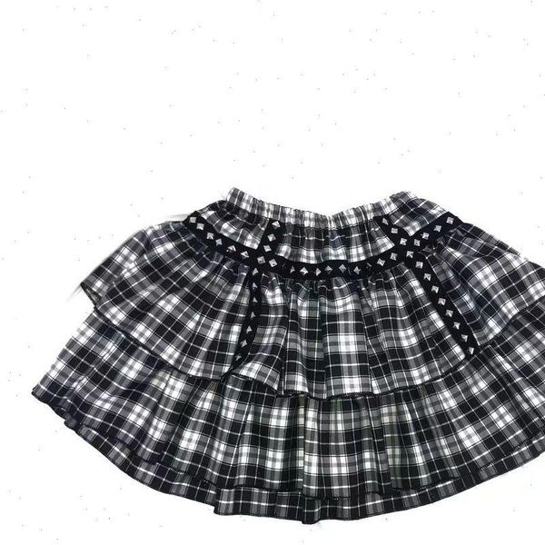 gothic white black plaid short women skirts rivet punk style double layer high waist ball gown mini female 
gothic white black plaid short women skirts rivet punk style double layer high waist ball gown mini female