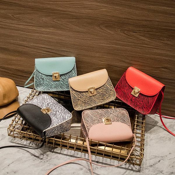 autumn / winter 2021 korean retro stripe magnetic buckle simple mobile phone bag with single shoulder and small square waist bags
autumn / winter 2021 korean retro stripe magnetic buckle simple mobile phone bag with single shoulder and small square waist bags