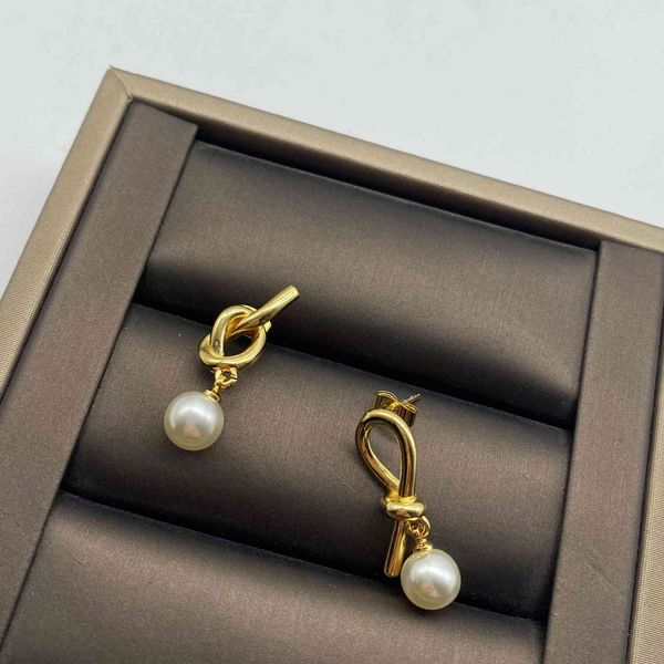 new irregular twisted small pearl earrings for women's fashion simple brass material 925 silver needle, Golden 
new irregular twisted small pearl earrings for women's fashion simple brass material 925 silver needle, Golden