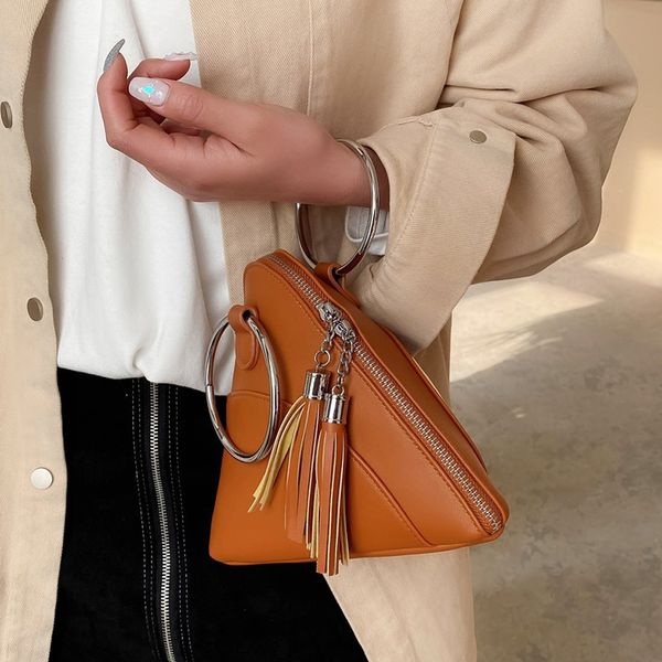 simple triangle pu leather wrist clutch bag for women 2021 mini handbags and purses fashion iron ring handle tassel chain design
simple triangle pu leather wrist clutch bag for women 2021 mini handbags and purses fashion iron ring handle tassel chain design