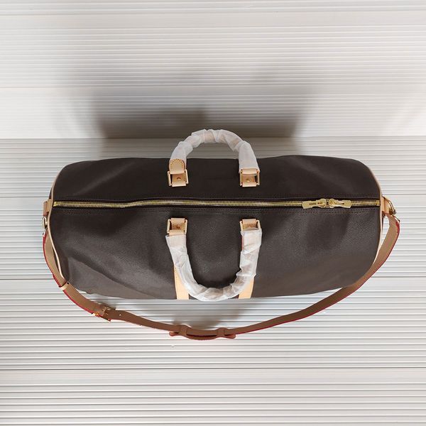 55cm luxury handbags large capacity women travel bags genuine leather designer men shoulder duffel bag on luggage bottom rivets with lock he
55cm luxury handbags large capacity women travel bags genuine leather designer men shoulder duffel bag on luggage bottom rivets with lock he