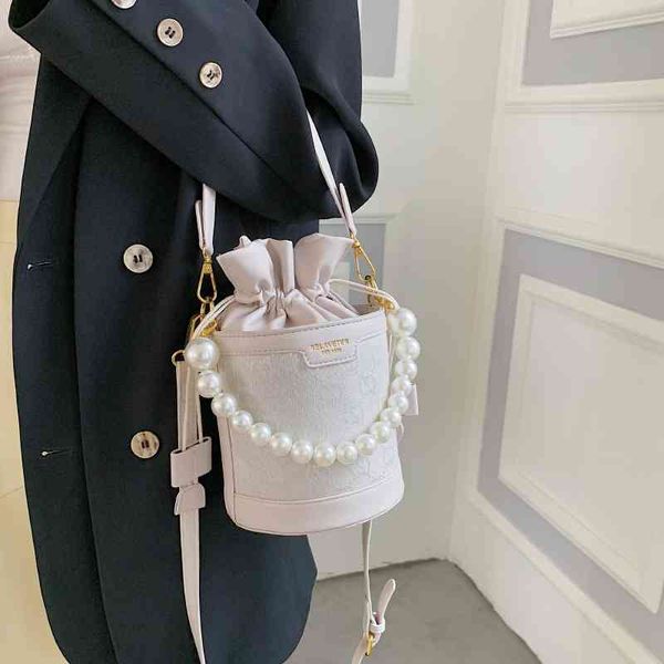 80% off simple design small bag women's summer leisure new fashion single shoulder messenger bag practical pearl portable bucket handba
80% off simple design small bag women's summer leisure new fashion single shoulder messenger bag practical pearl portable bucket handba