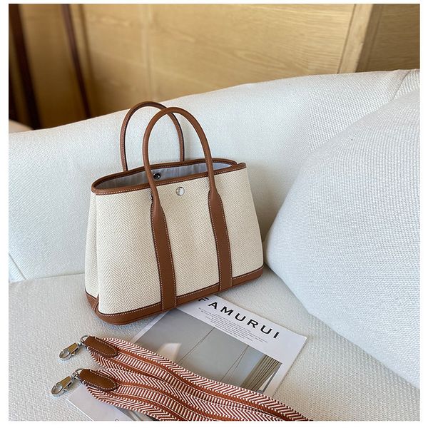 design bags high leather women's bag canvas with cowhide golden brown garden bag large capacity one shoulder portable tote bag
design bags high leather women's bag canvas with cowhide golden brown garden bag large capacity one shoulder portable tote bag