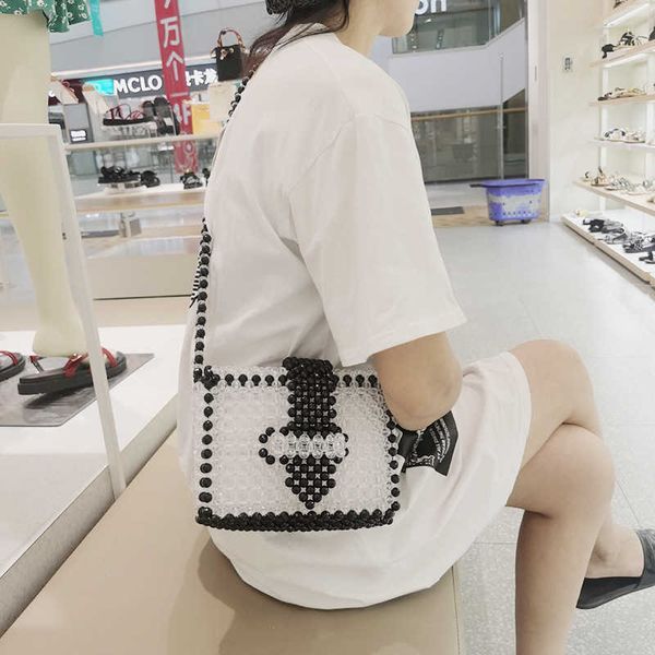 slanting across elegant style pearl bag handmade beaded weaving niche dign fashion women's bag
slanting across elegant style pearl bag handmade beaded weaving niche dign fashion women's bag