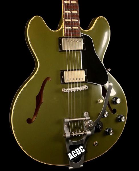 1964 es 345 olive drab matte green semi hollow body jazz electric guitar bigs tremolo bridge, varitone knobs, tuilp tuners, chrome hardware
1964 es 345 olive drab matte green semi hollow body jazz electric guitar bigs tremolo bridge, varitone knobs, tuilp tuners, chrome hardware