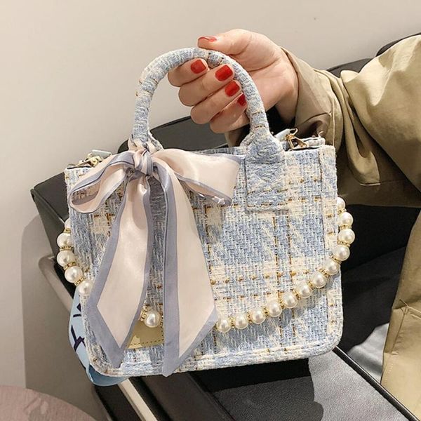 evening bags ribbon pearl tote bag 2021 woolen cloth women's designer handbag wide shoulder strap messenger
evening bags ribbon pearl tote bag 2021 woolen cloth women's designer handbag wide shoulder strap messenger